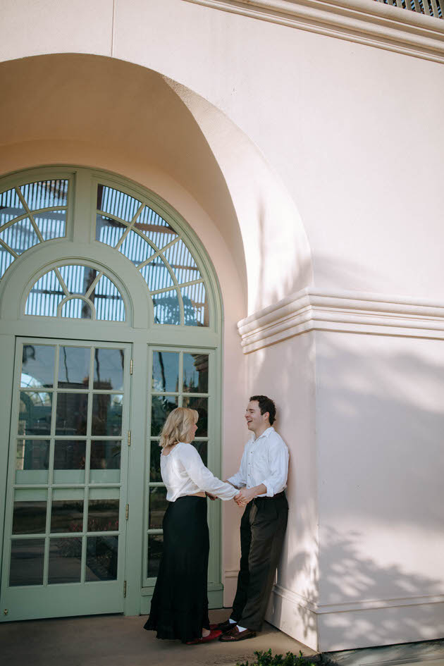 couple standing in front of a botanical building in san diego