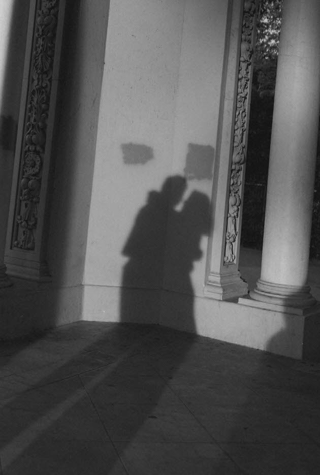 black and white photo of the shadow of two people who love each other