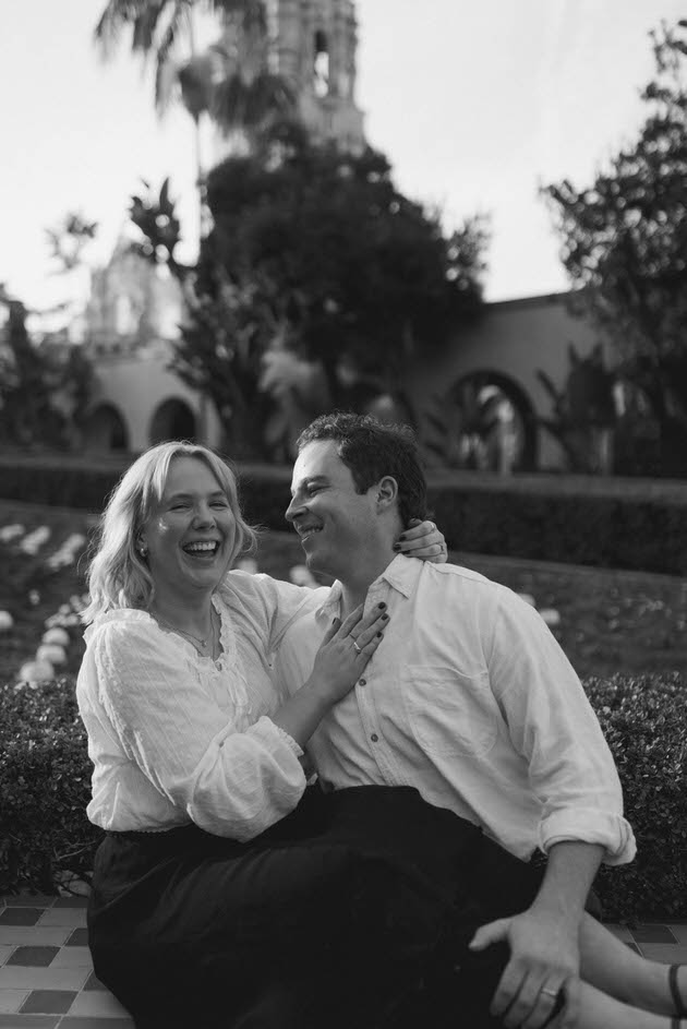 Couple sitting together and laughing together in San Diego
